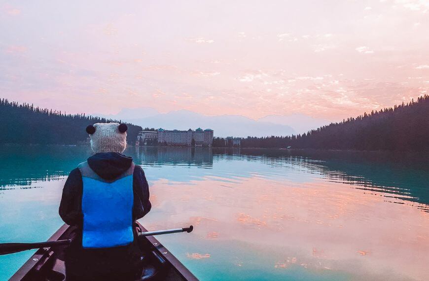 me canoeing on lake louise at sunrise