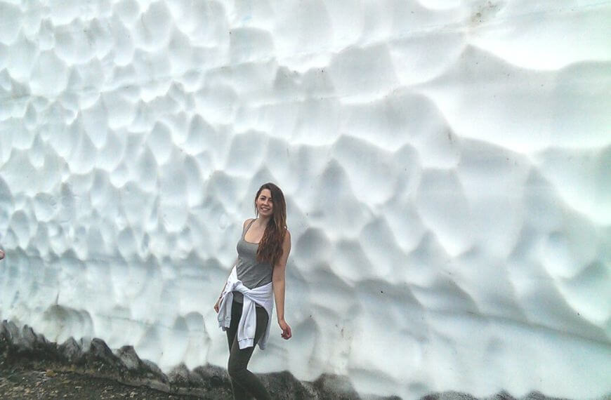 standing in front of huge snow walls in whistler