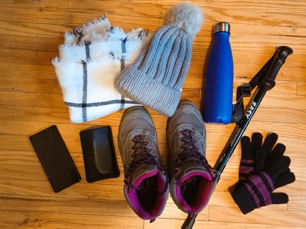 Some items to take hiking laid on the floor