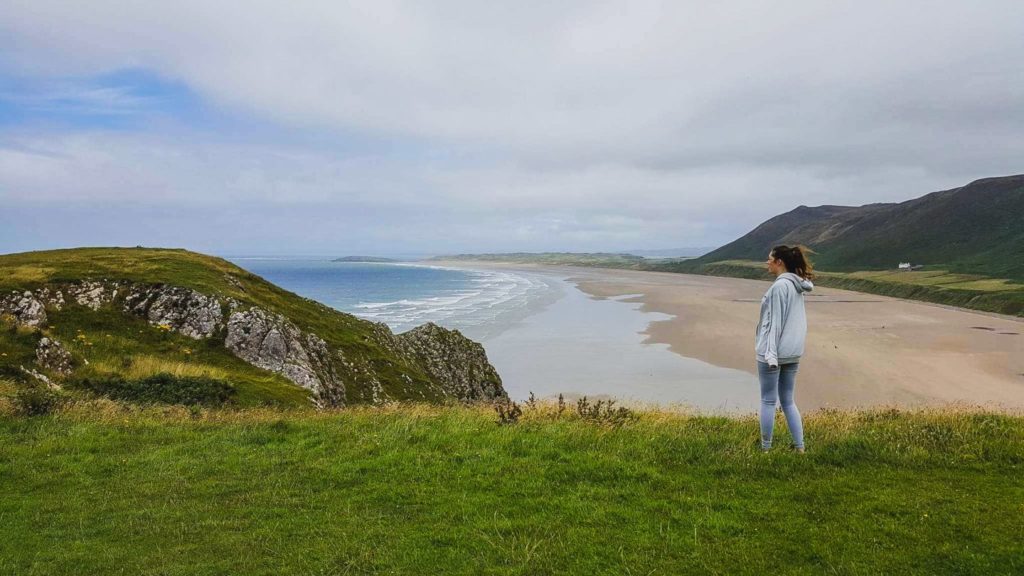 rosili bay in wales on windy day while travelling for a long time