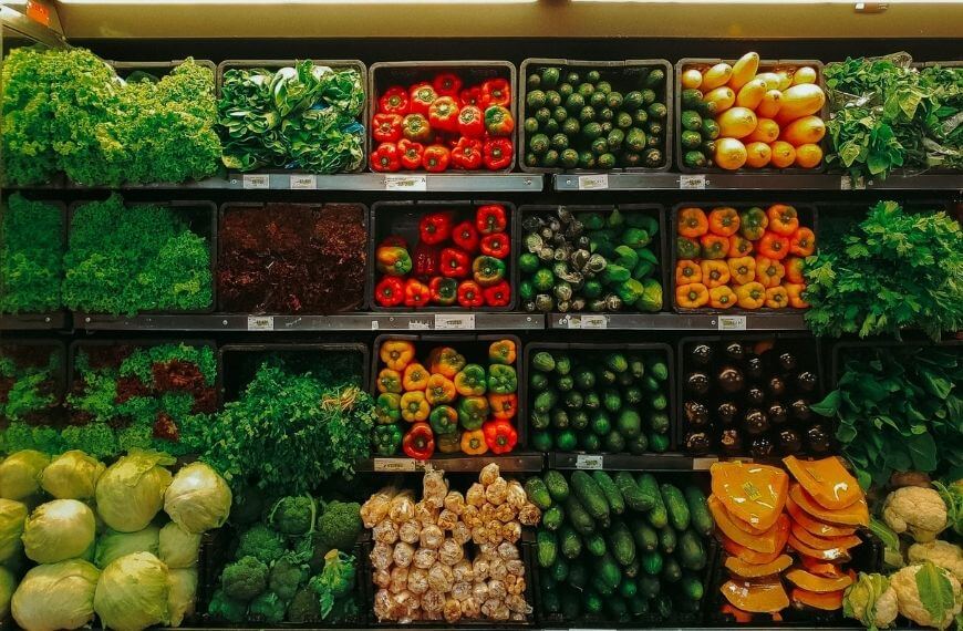 grocery shelves with lots of vegetables