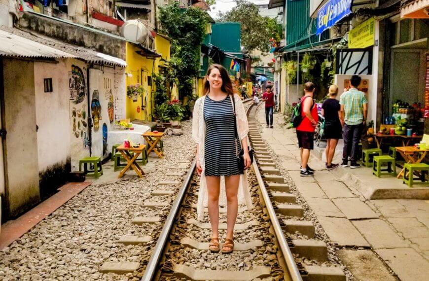 me standing on the track of hanoi's train street a backpackers stop on the southeast asia route
