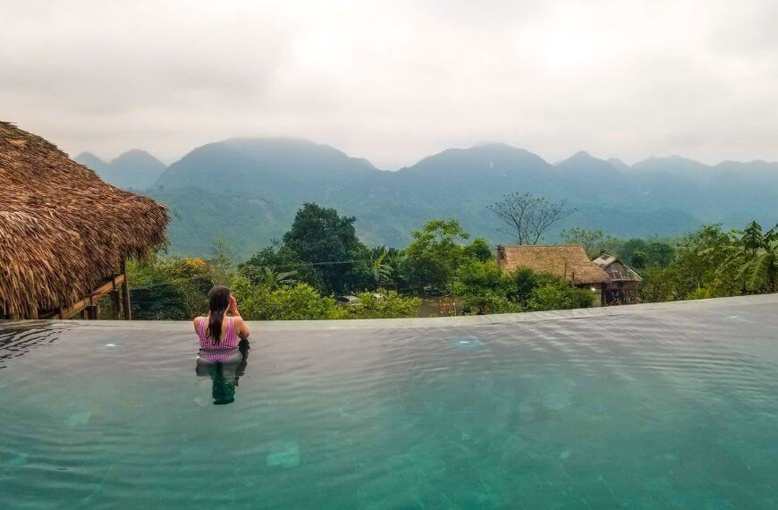 me in an infinity pool in mai chau - my favourite stop on our backpackers route through southeast asia