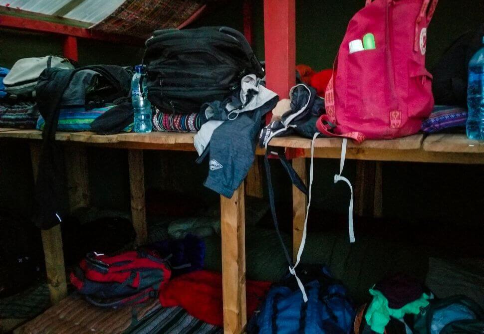 Bags and luggage on our bunk beds during a volcano hike