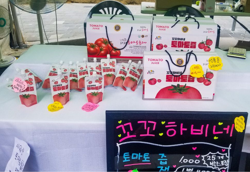 Different tomato flavoured drinks available for purchase at the Hwacheon tomato festival in Korea