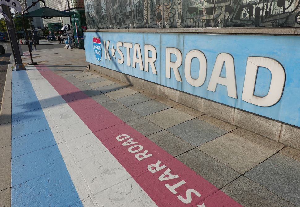 K Star Road sign with the striped floor and the famous hastag of #gangnamdol