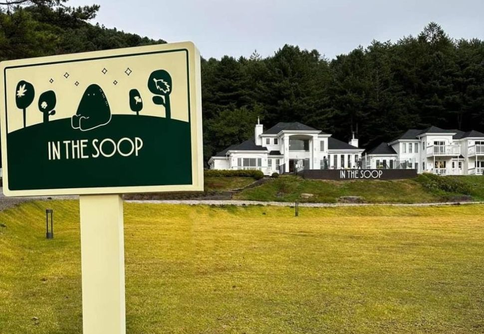 In the soop sign and the building in the background which is one of the locations the BTS boys stayed in Korea during their 2nd season reality show