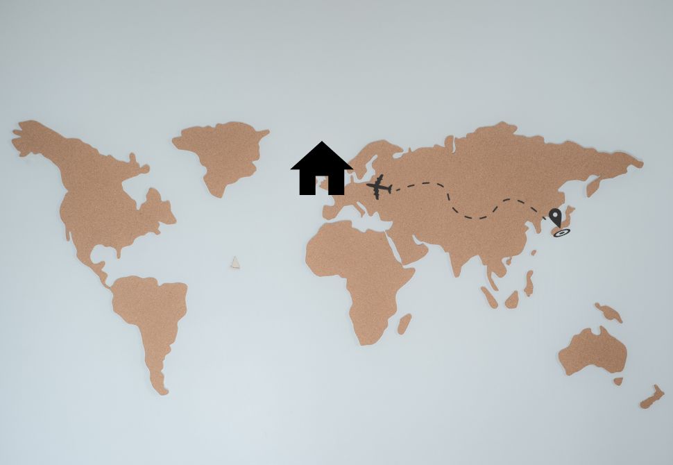 a world map with a house graphic on the UK and a plan flying from Asia - how to handle moving back home after living abroad